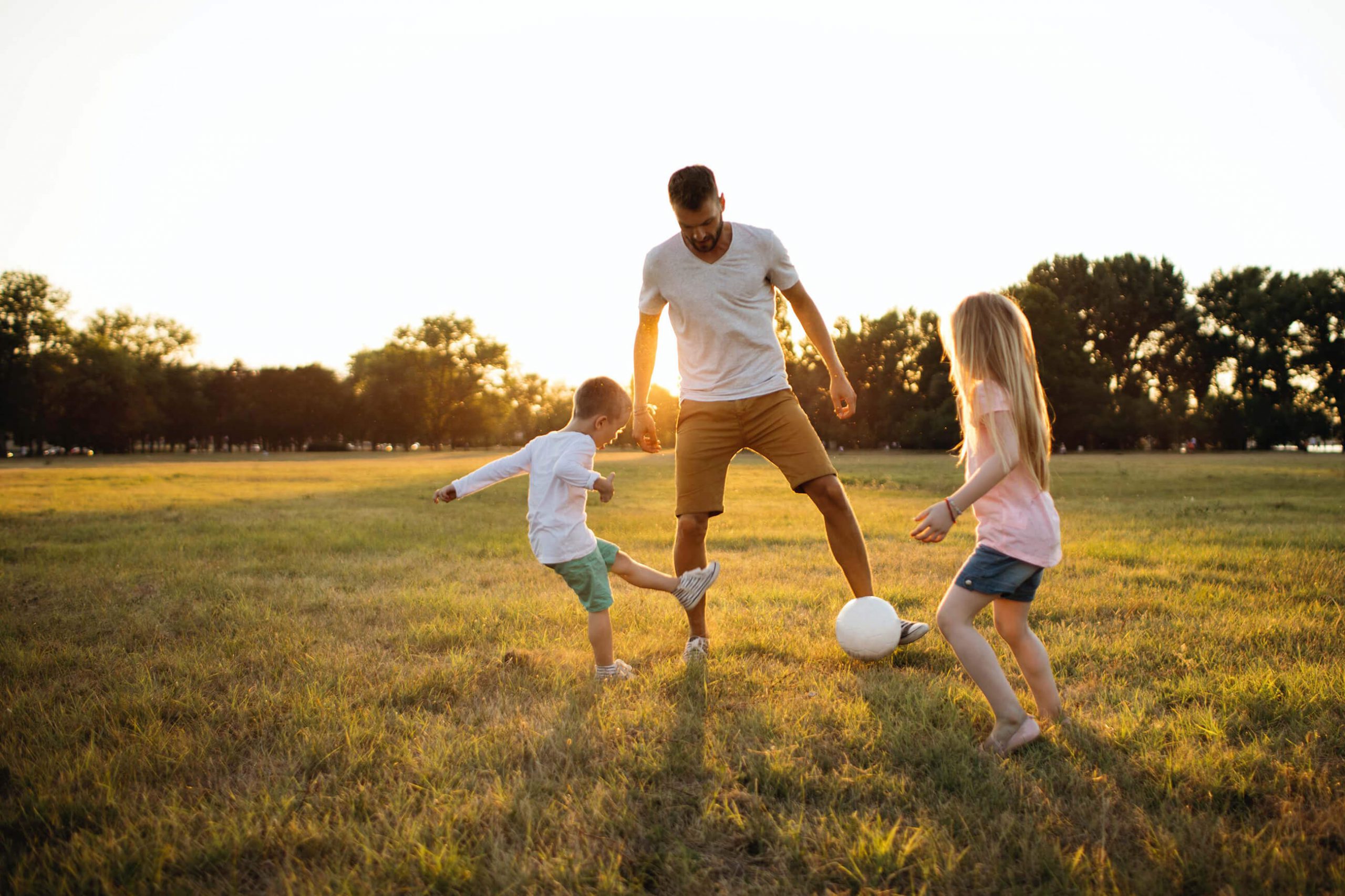 family-playing-soccer